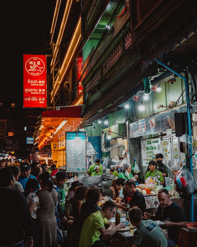 Thai street vendor preparing Pad Thai at a night market
