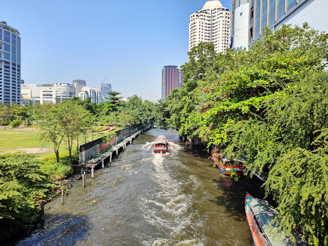 Traditional Thai long-tail boat cruising Bangkok's canals