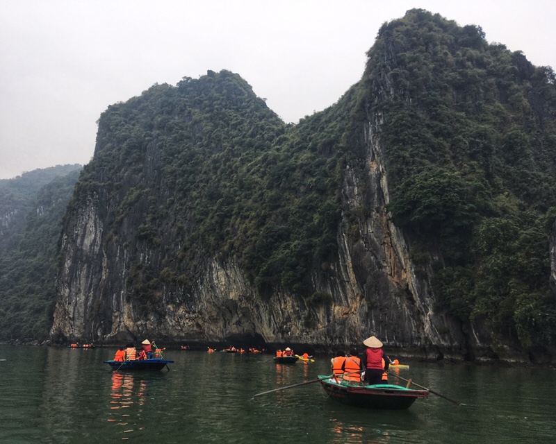 Tourists kayaking through Ha Long Bay